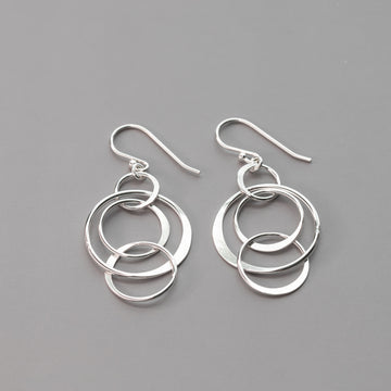 handmade with solid nickel free sterling silver these artisan crafted circles earrings are hand hammered and polished to a high shine.  Nickel free sterling silver dangle drop earrings for her