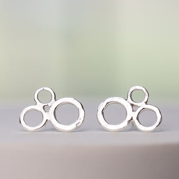 handmade nickel free sterling silver earrings in a cute bubble stud design.  Three circles are clustered together with artisan hammered details.  Handcrafted Argentium Sterling Silver Jewelry