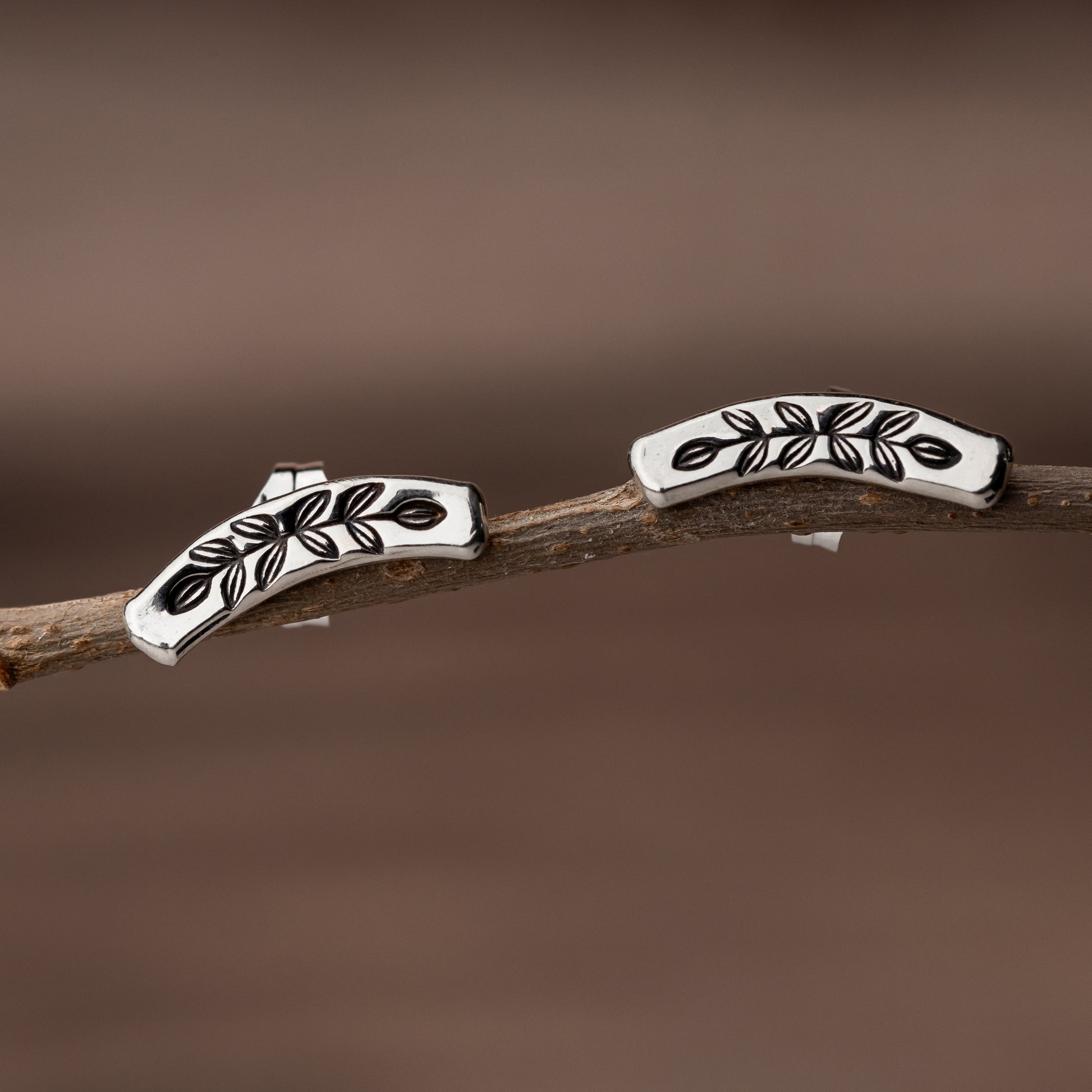 minimalist sterling silver jewelry in an easy to wear curved stud earring for her