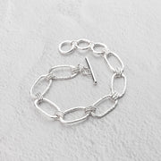 Handmade with Argentium Sterling silver, this unique toggle bracelet features artisan details like hand hammered textures and a gorgeous high shine.  The adjustable toggle is secure and easy to put on yourself.
