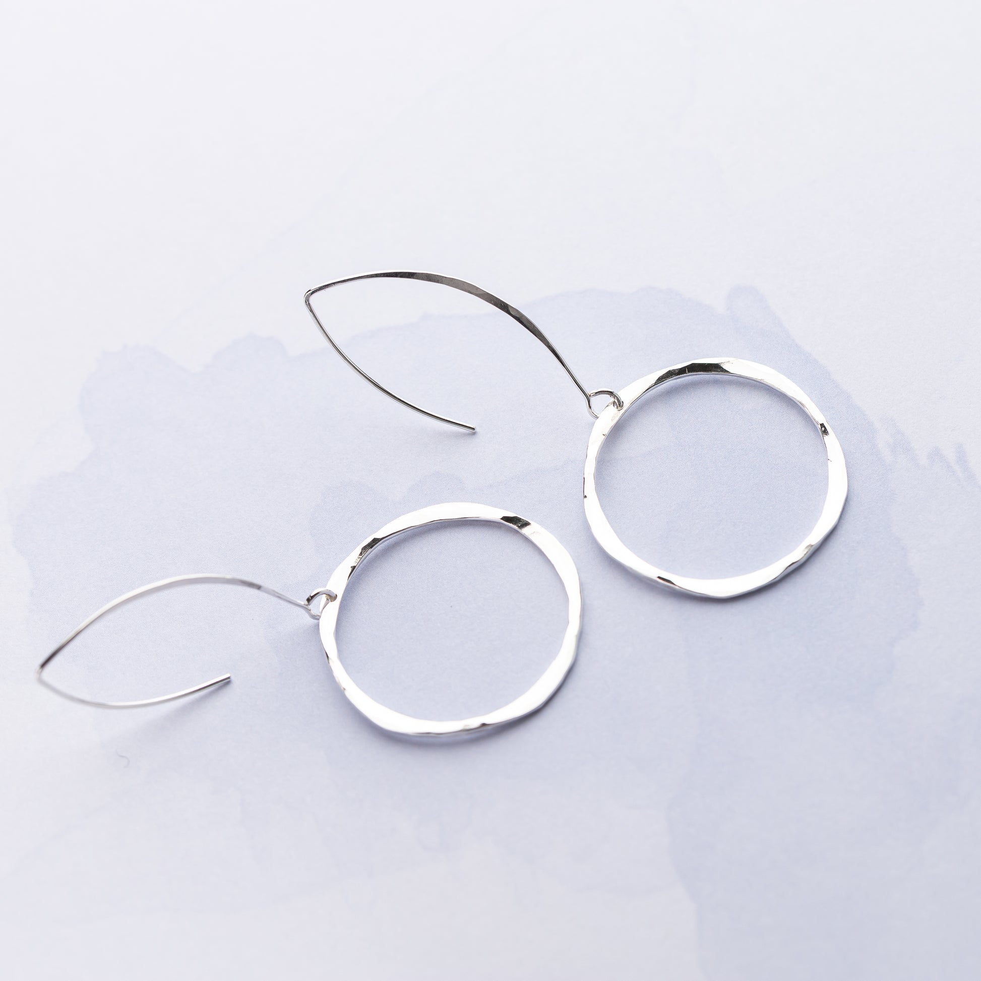 Nickel free sterling silver statement earrings on white background