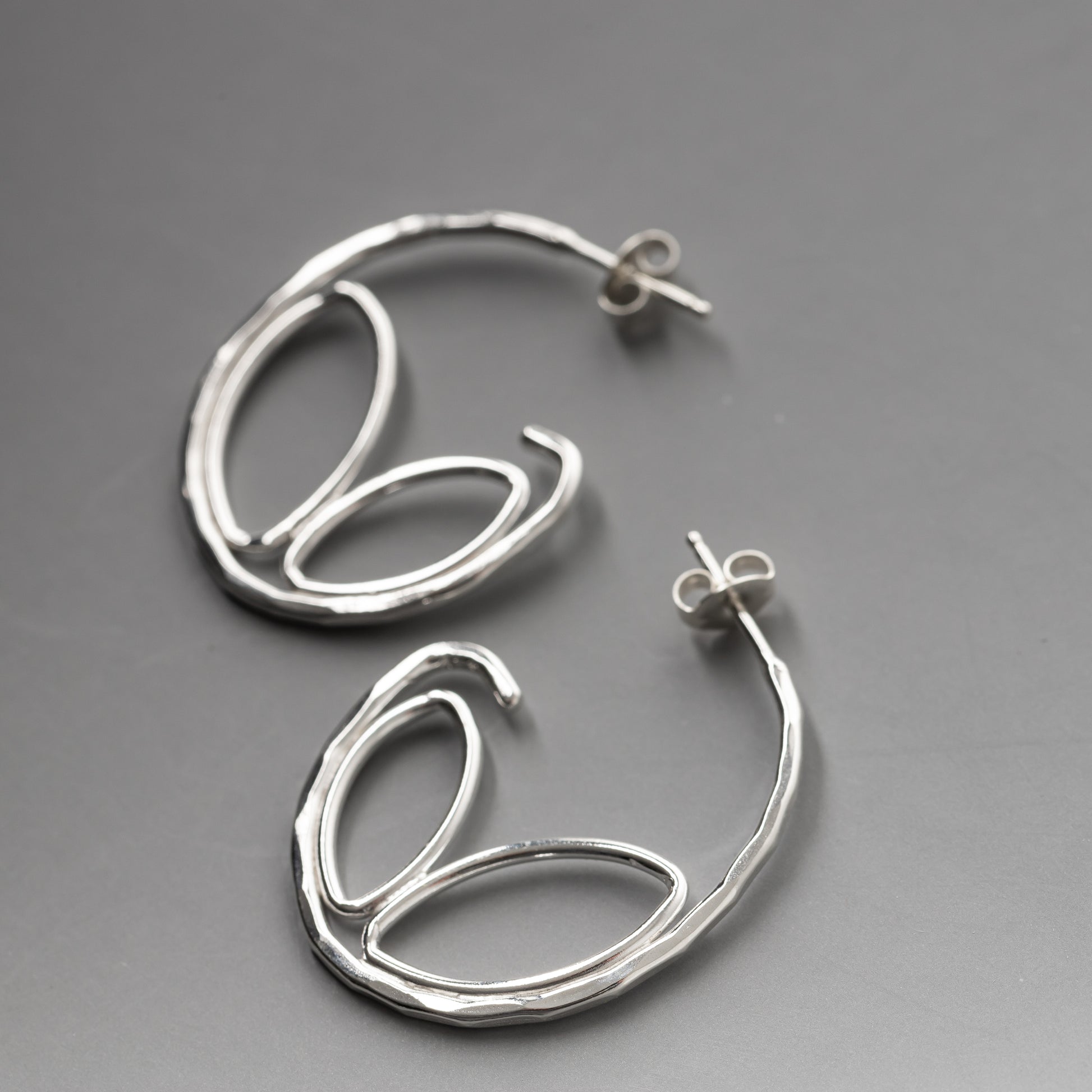 handmade sterling silver hoop earrings, unique handcrafted silver hammered hoop earrings.  Botanical Sterling silver jewelry with artisan details