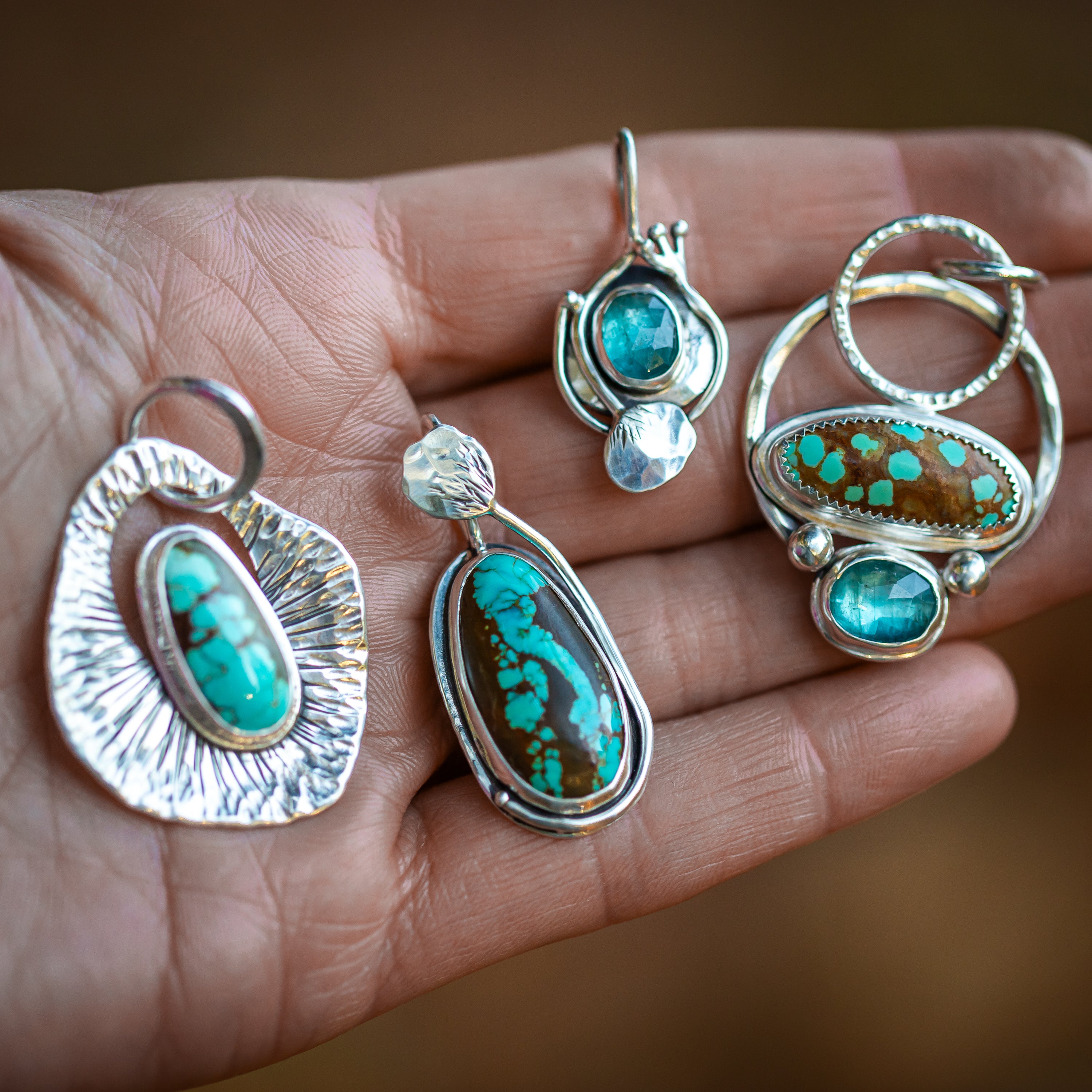 Handmade sterling silver and turquoise jewelry featuring kyanite gemstones.  These unique one of a kind designs are handcrafted in our studio in somers Ct