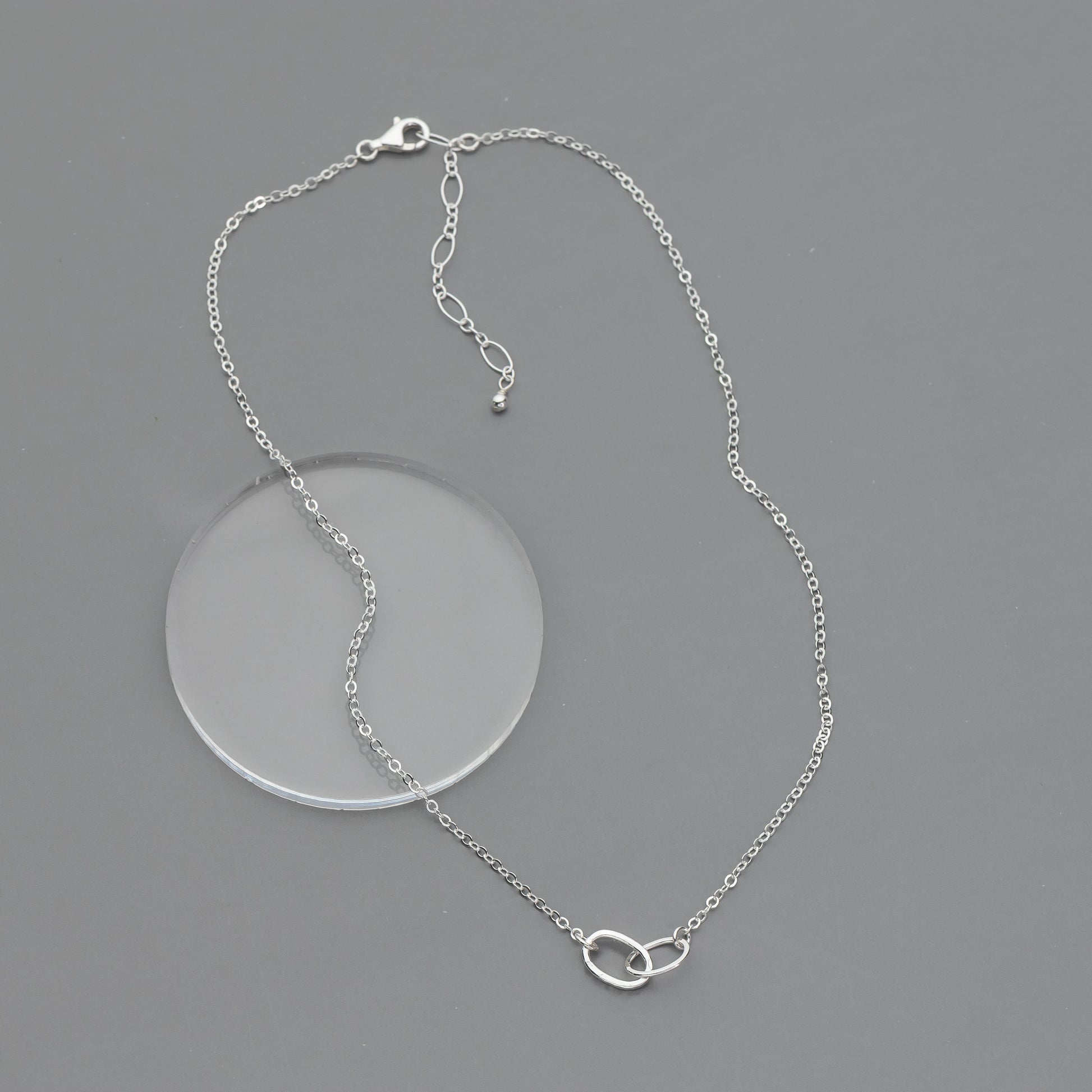 handmade sterling silver chain necklace on a gray background