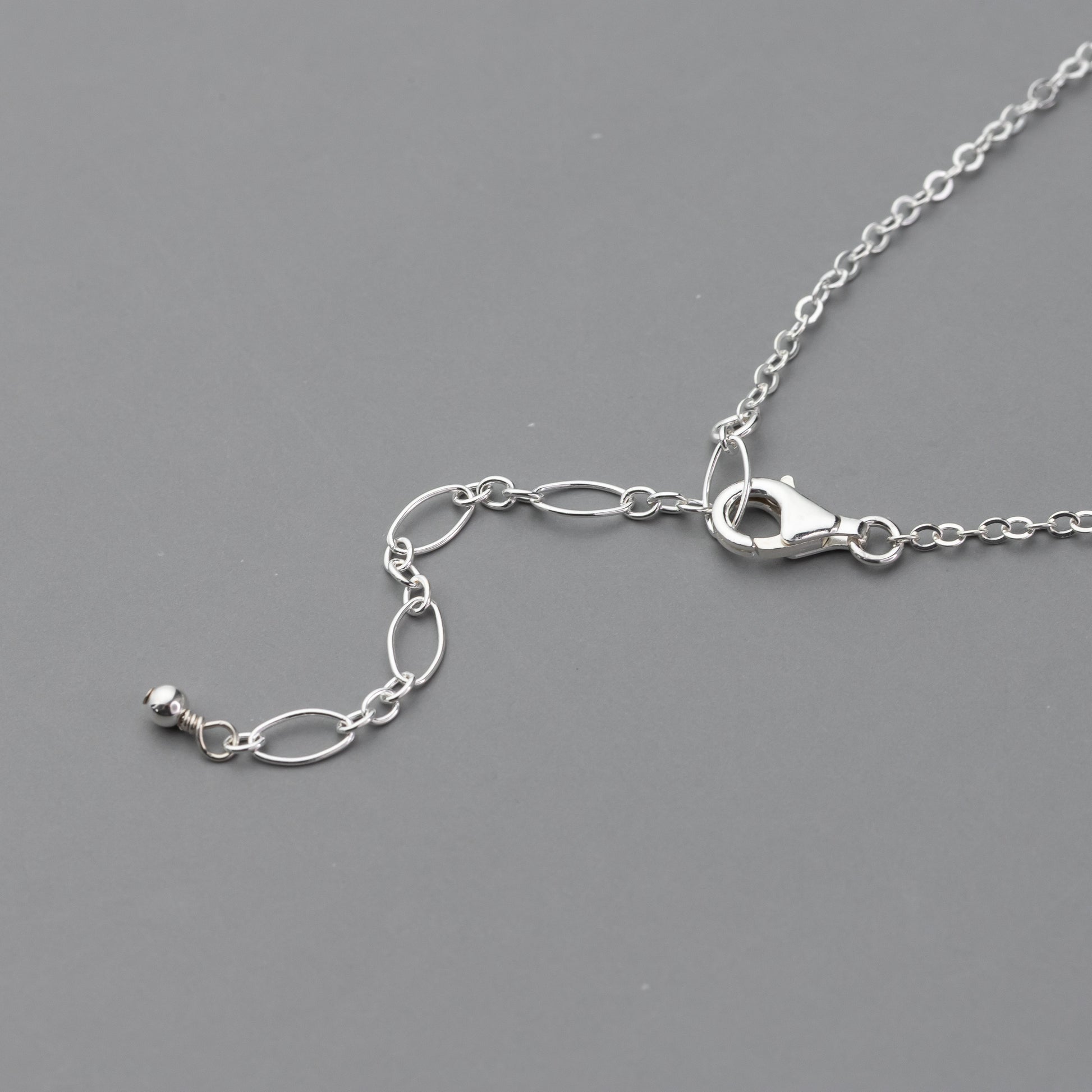 Adjustable length sterling silver chain with a lobster claw clasp
