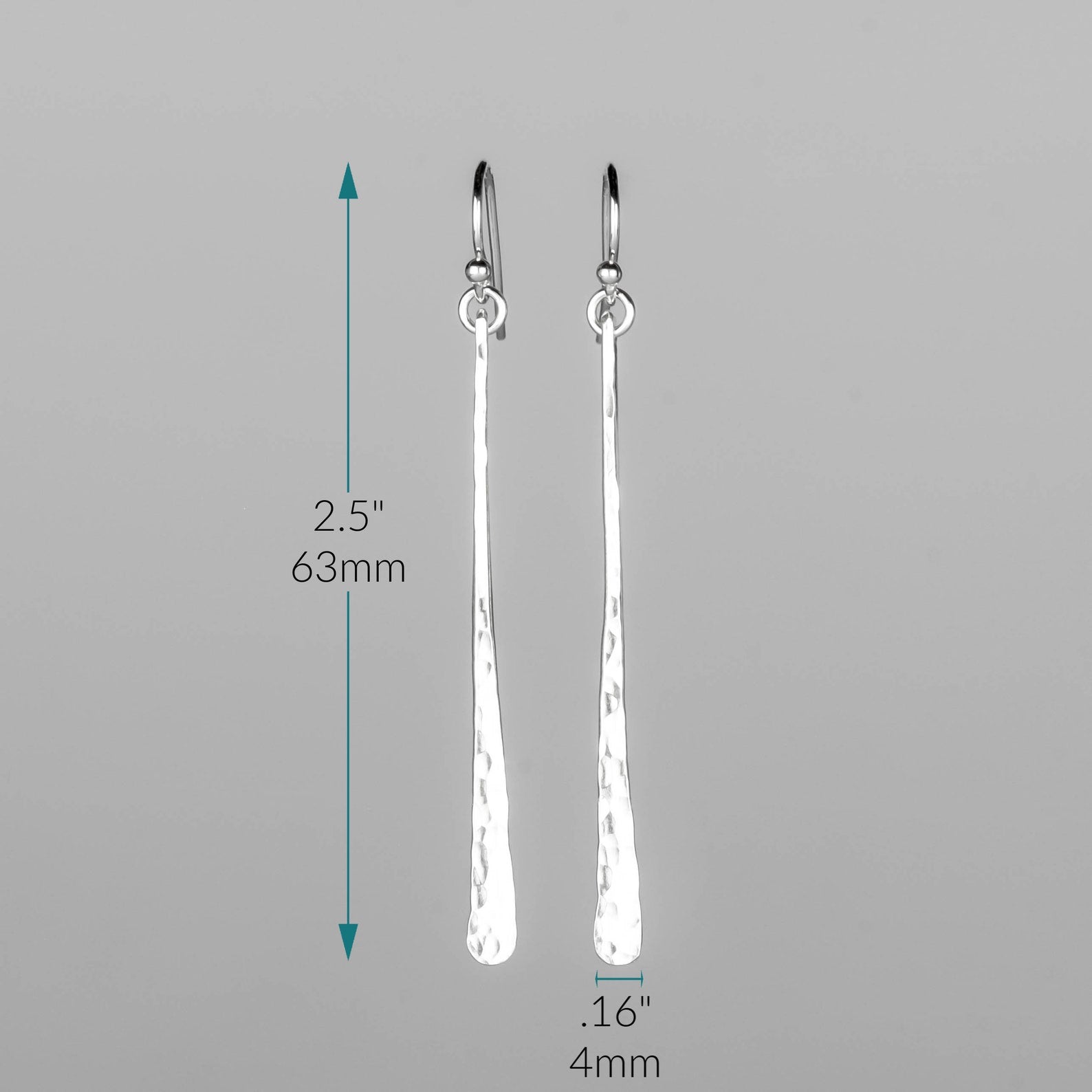 A pair of silver bar earrings with a textured finish, shown with dimension markings indicating a total height of 2.5 inches (63 mm) and a width of 0. Handmade by Lizardi Jewelry 