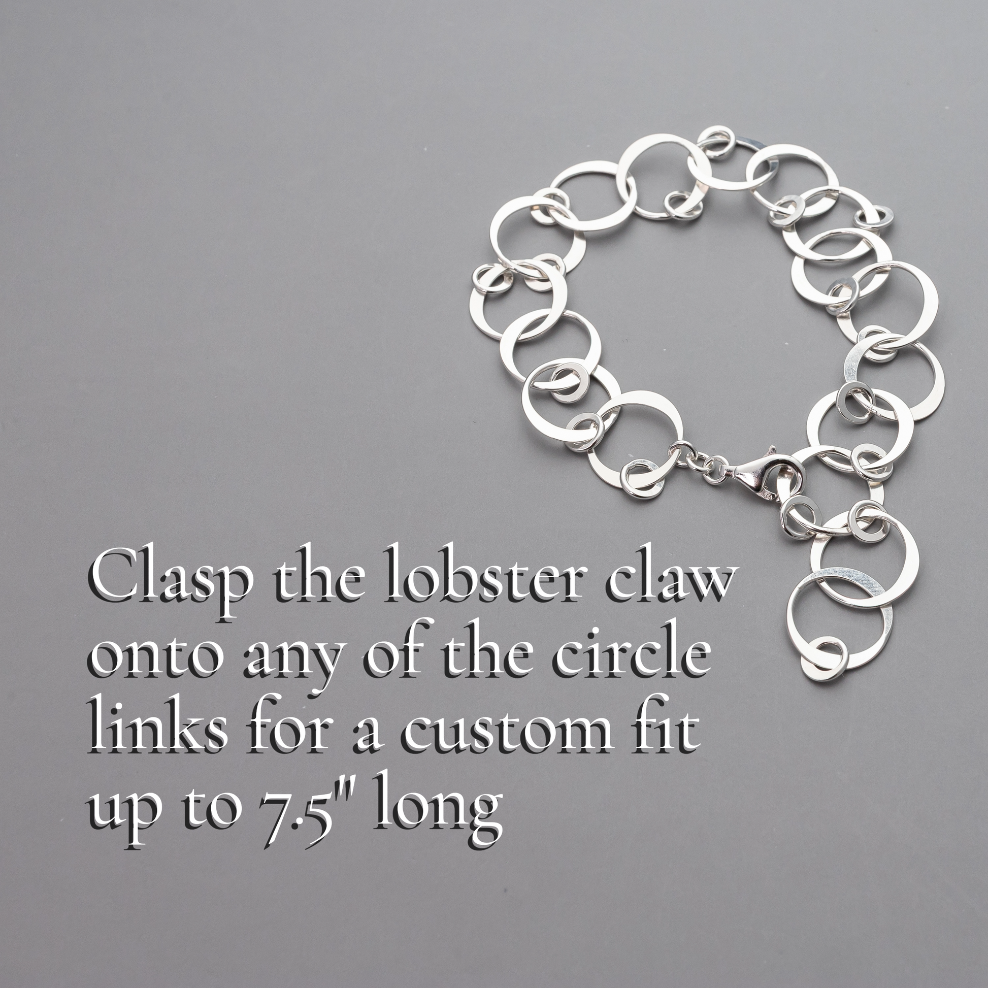 Handmade sterling Silver chain bracelet with text on a gray background
