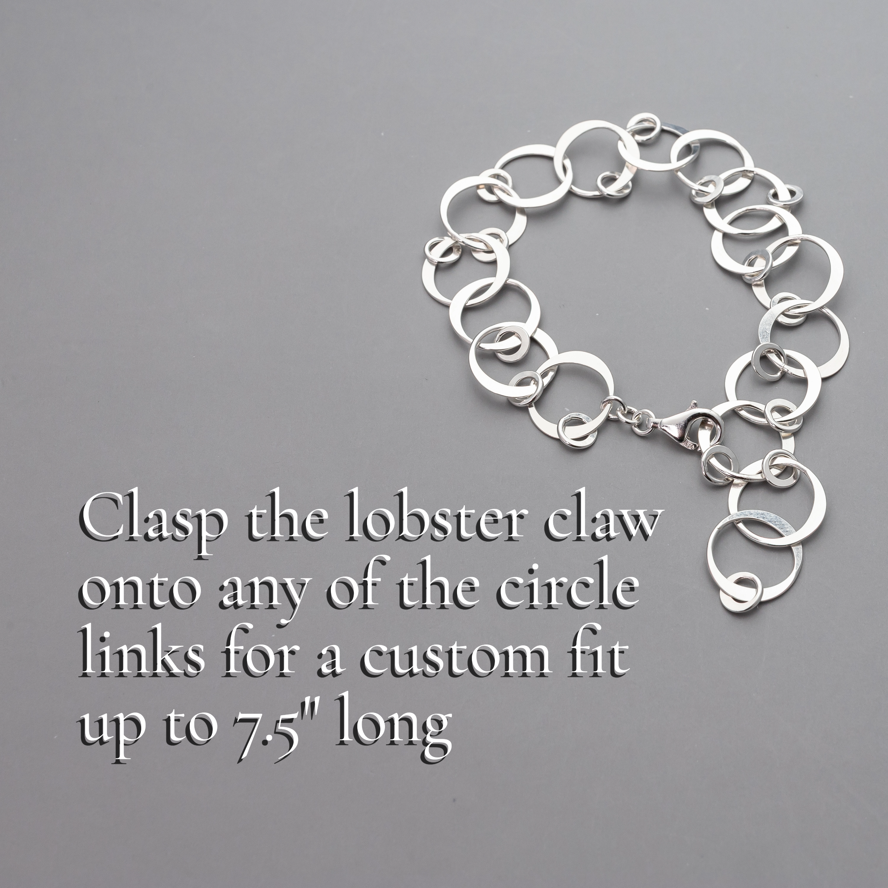 Handmade sterling Silver chain bracelet with text on a gray background