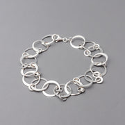 Sterling Silver chain bracelet on a gray background