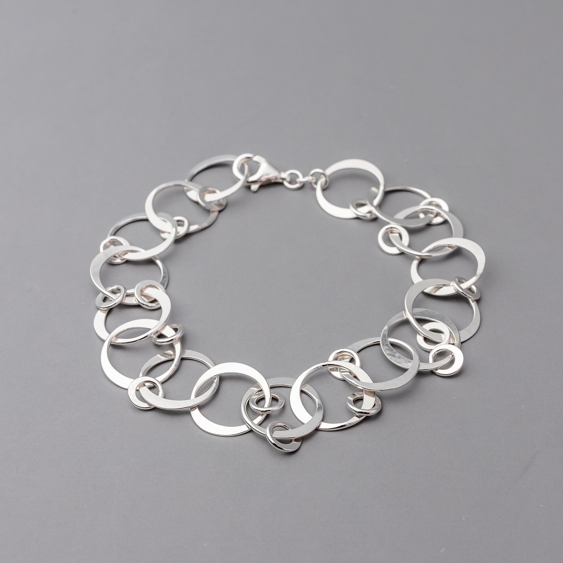 Sterling Silver chain bracelet on a gray background