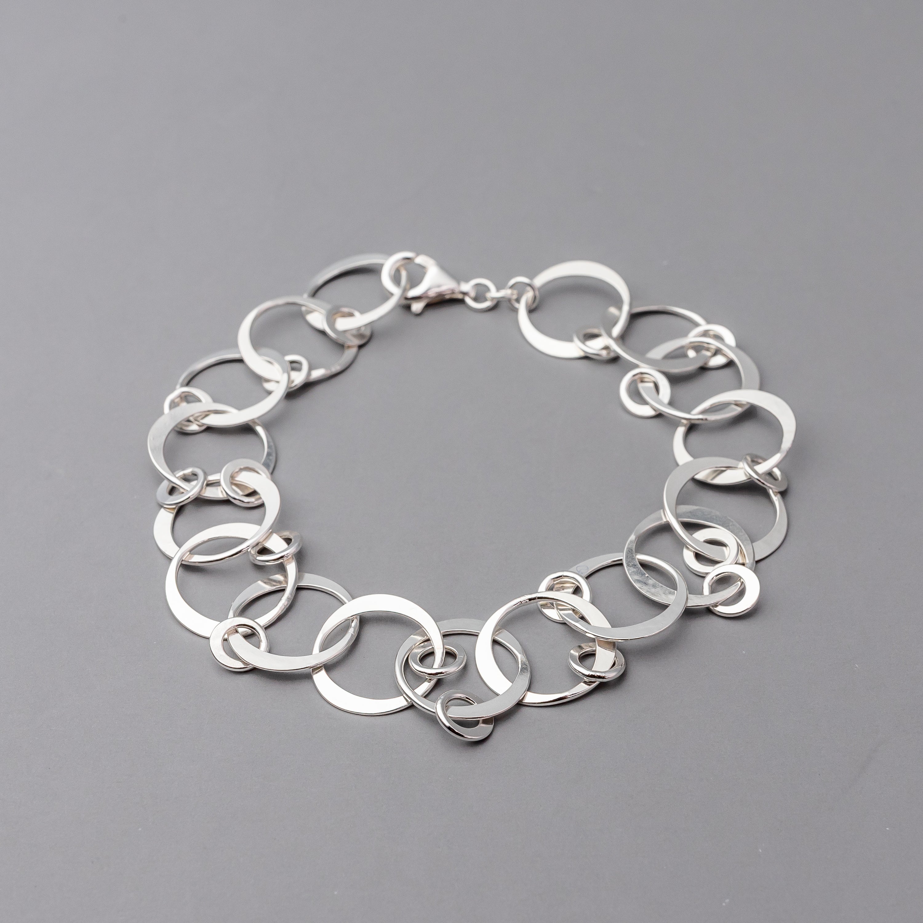 Sterling Silver chain bracelet on a gray background