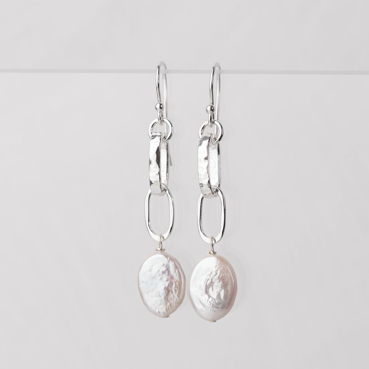 handmade freshwater pearl dangle earrings with hand hammered sterling silver links and oval coin pearls
