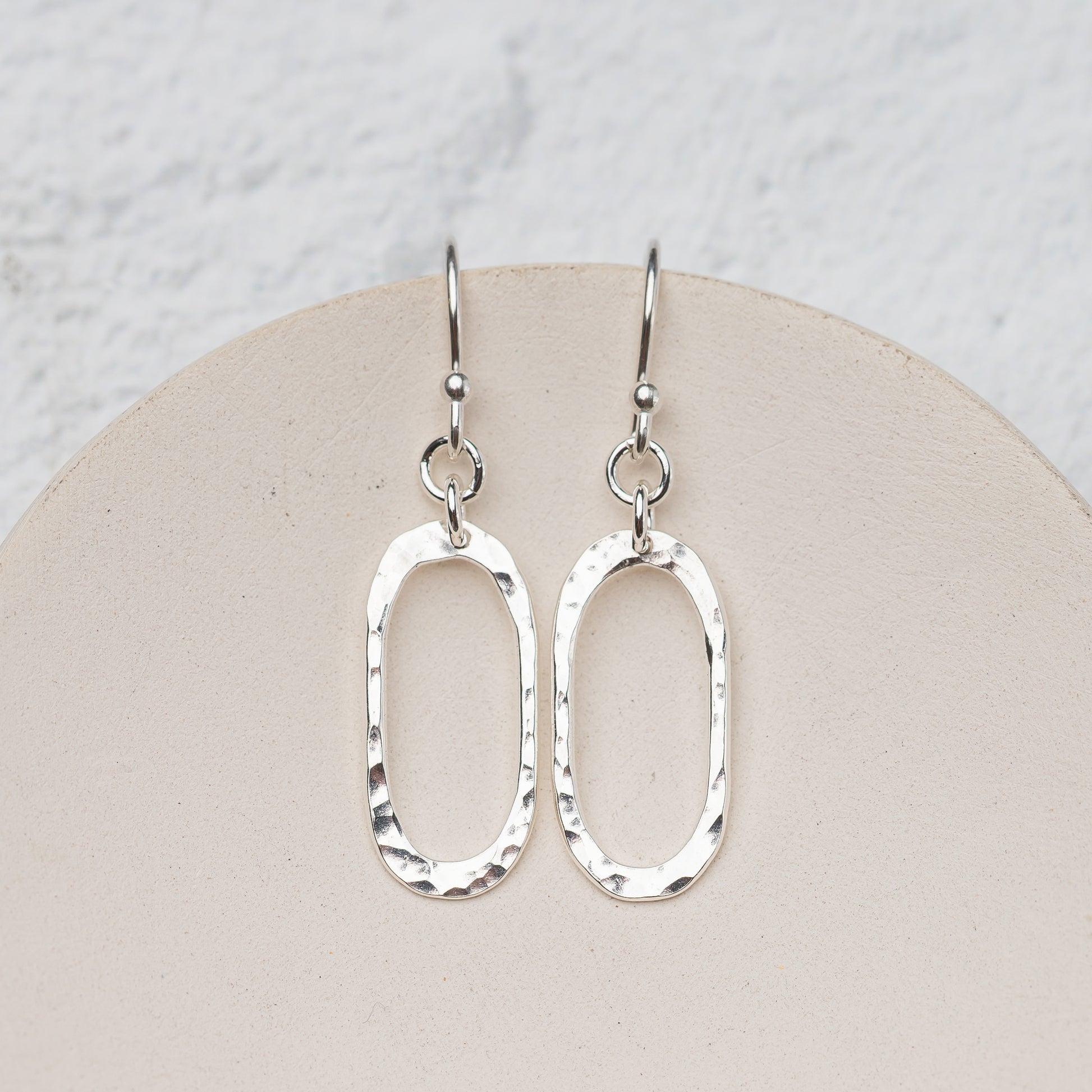 Lightweight hammered silver oval drop earrings