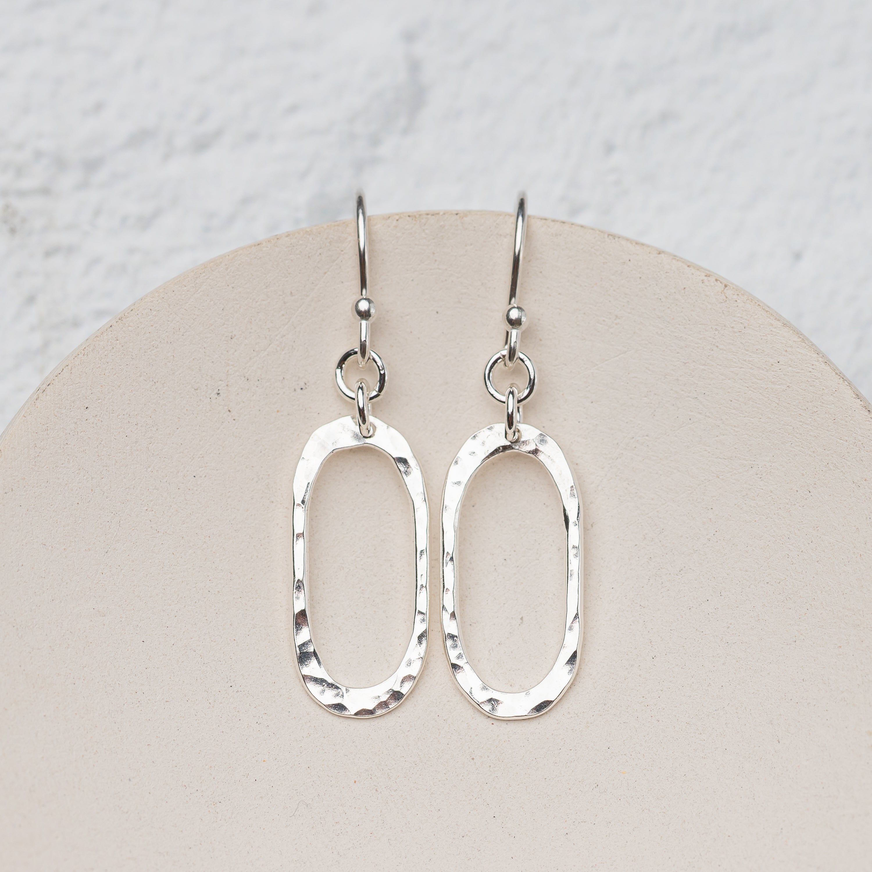 Lightweight hammered silver oval drop earrings