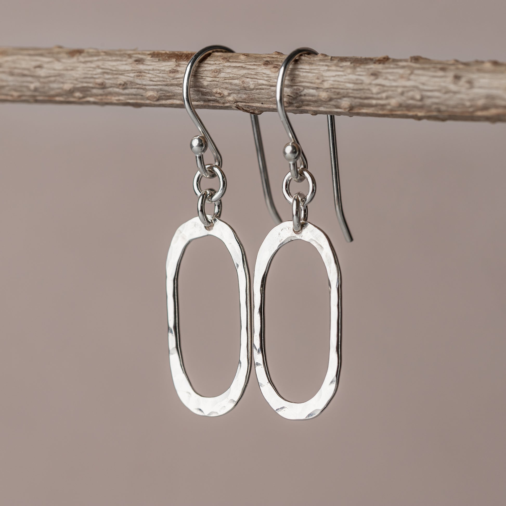 High polish hammered silver oval earrings