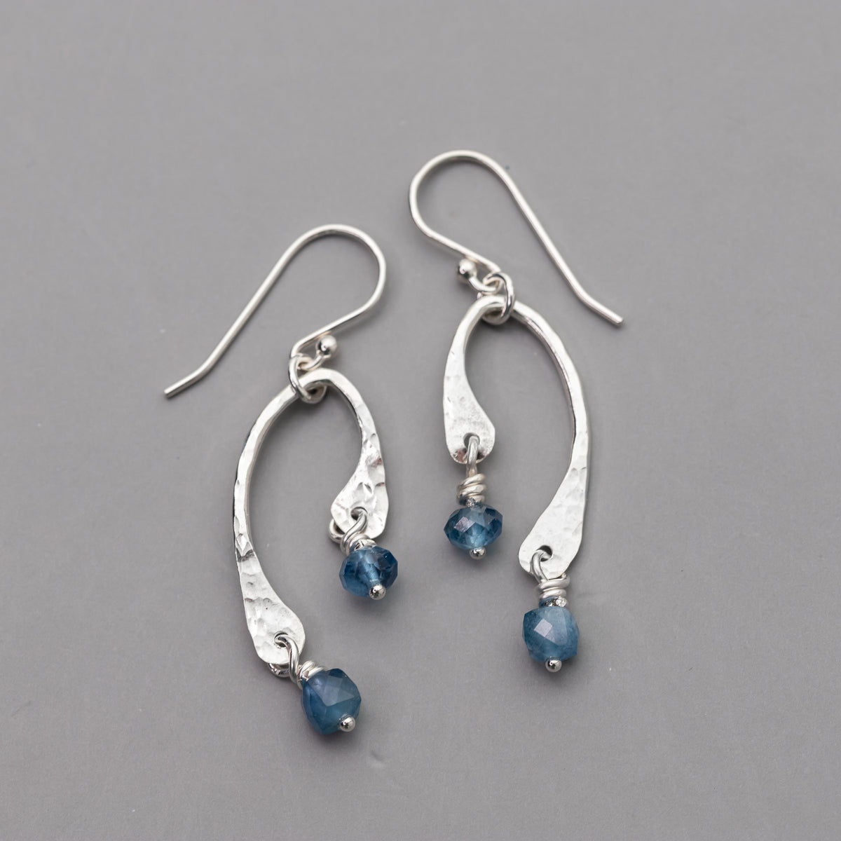 hammered artisan silver jewelry with natural aquamarine stones in a curved unique design