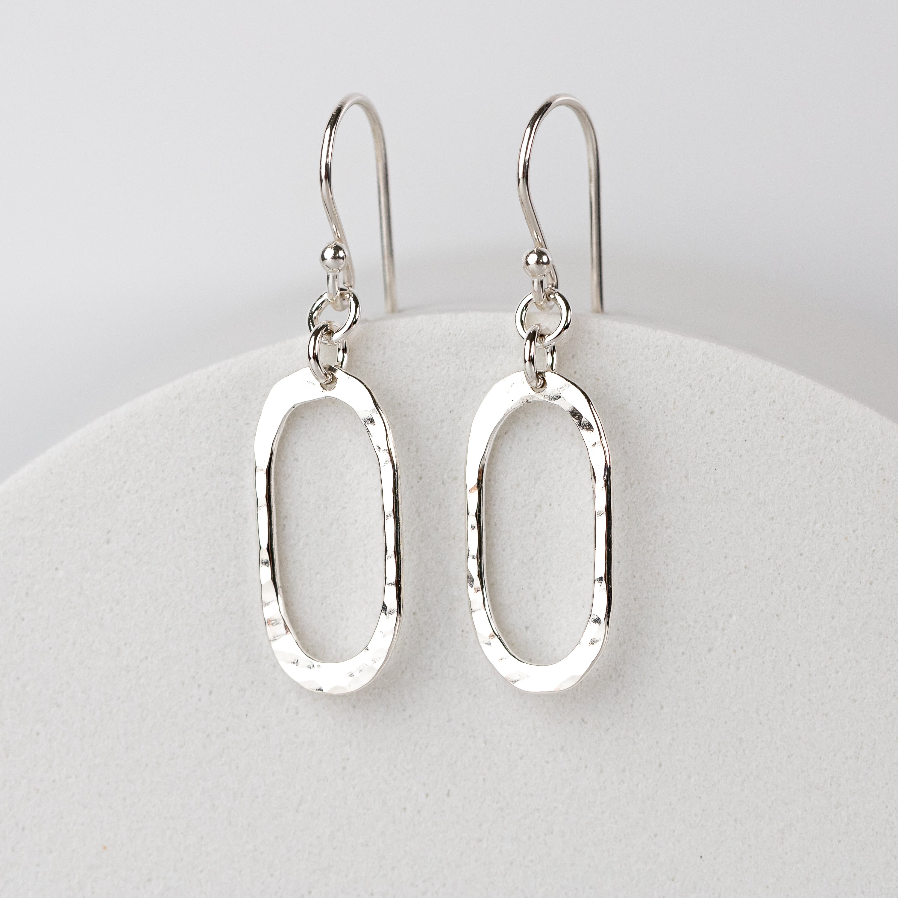Handmade silver oval dangle earrings in Argentium sterling
