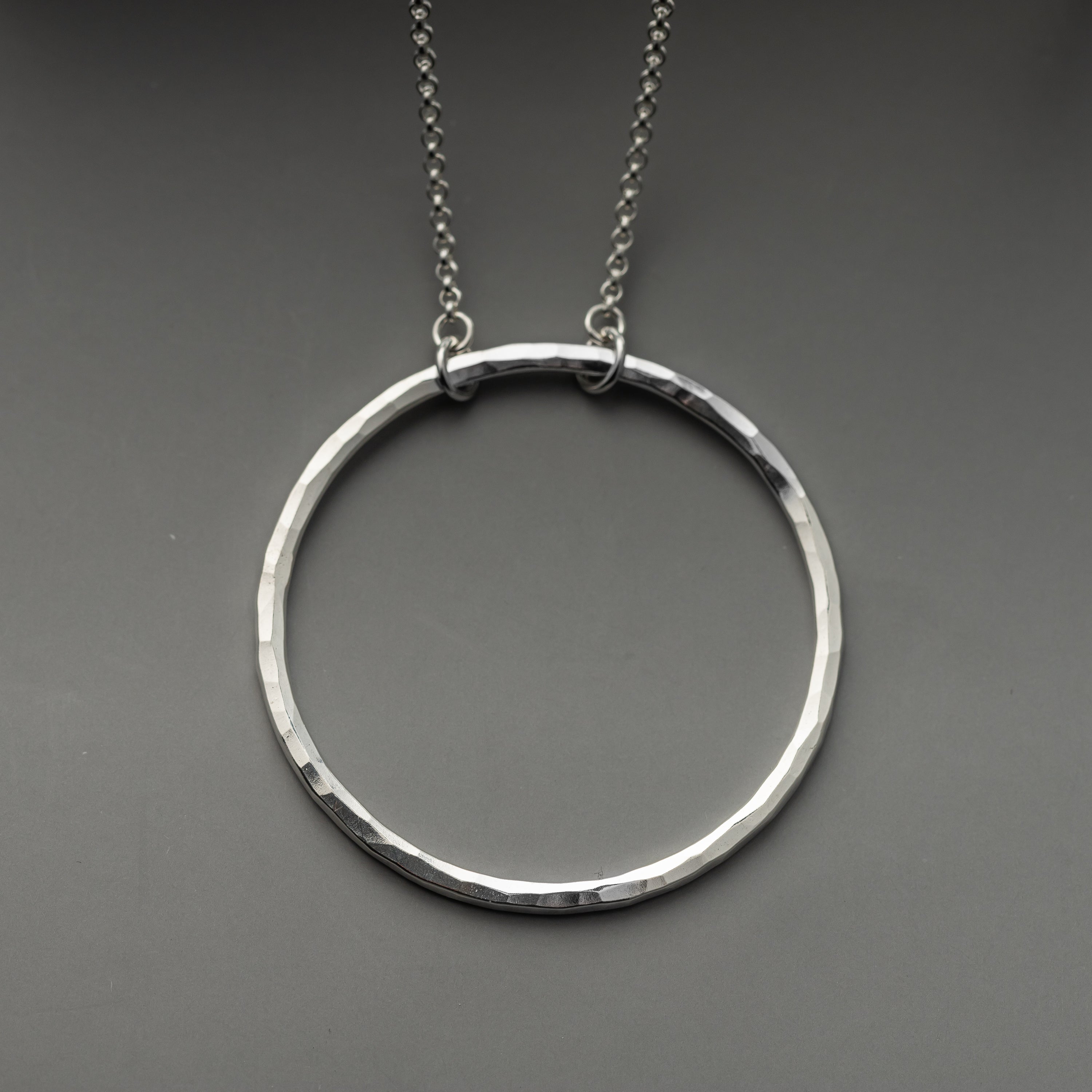handmade silver circle necklace with hammered silver