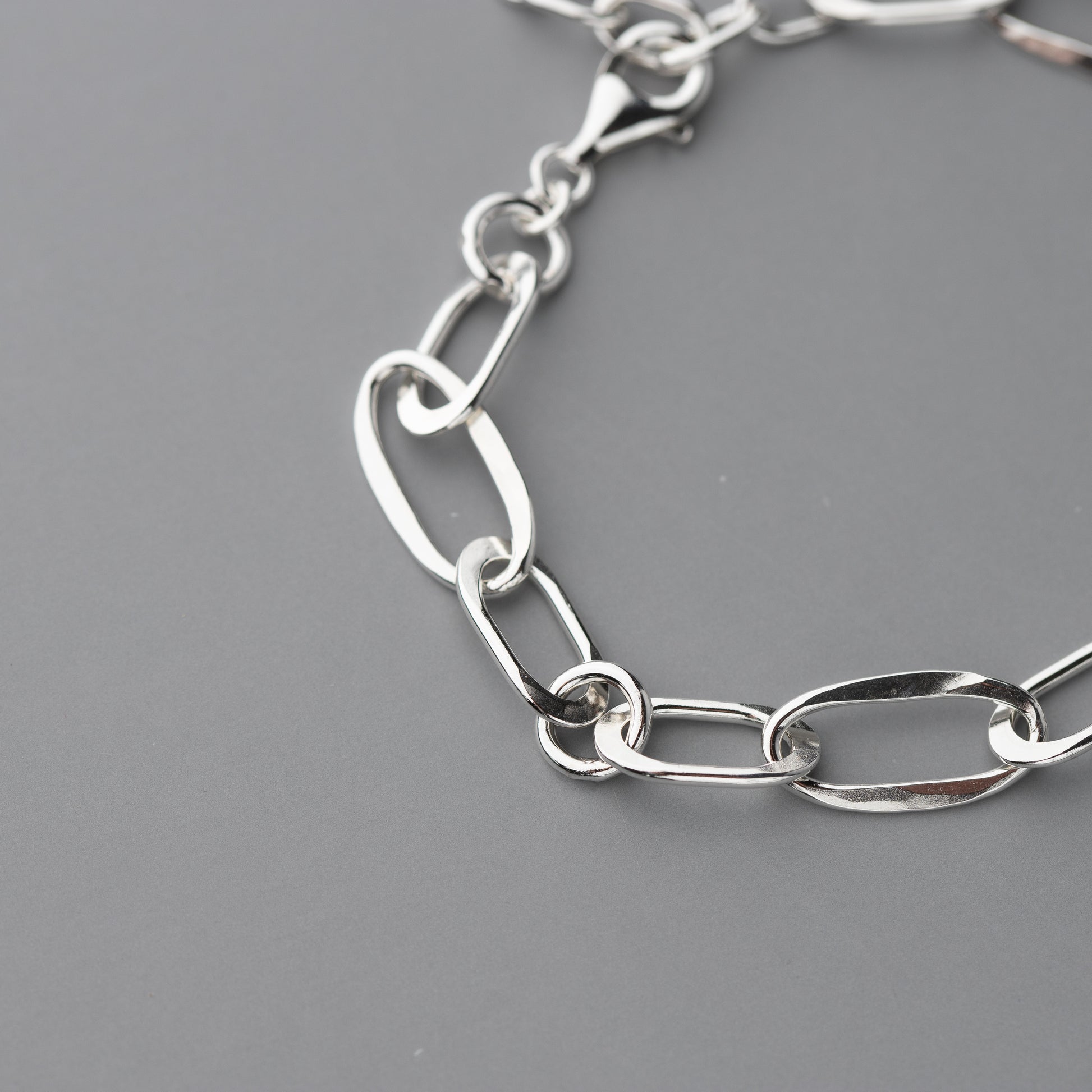 Close-up of welded oval and round links with textured finish