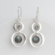 handmade sterling silver dangle earrings with labradorite stone dangles inside hammered silver frames
