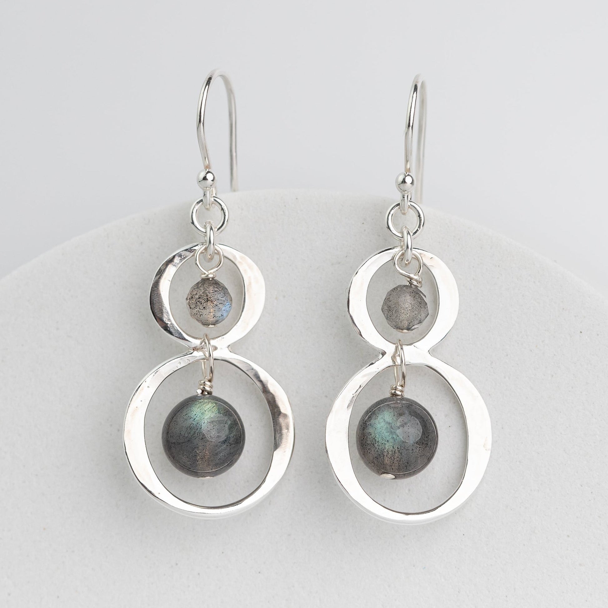 handmade sterling silver dangle earrings with labradorite stone dangles inside hammered silver frames