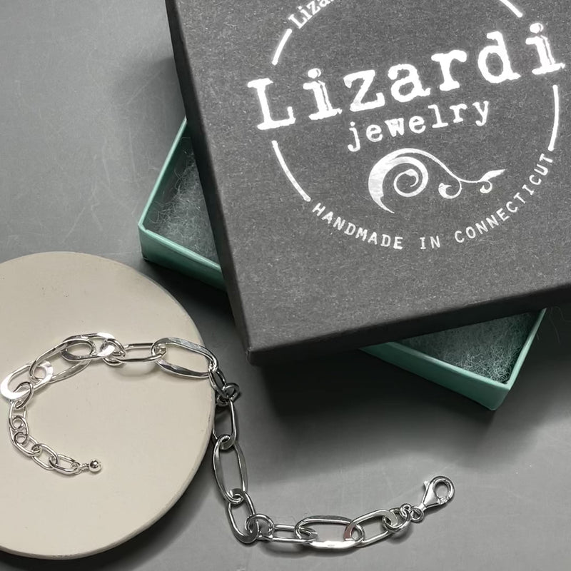 Close-up of welded oval and round links with textured finish