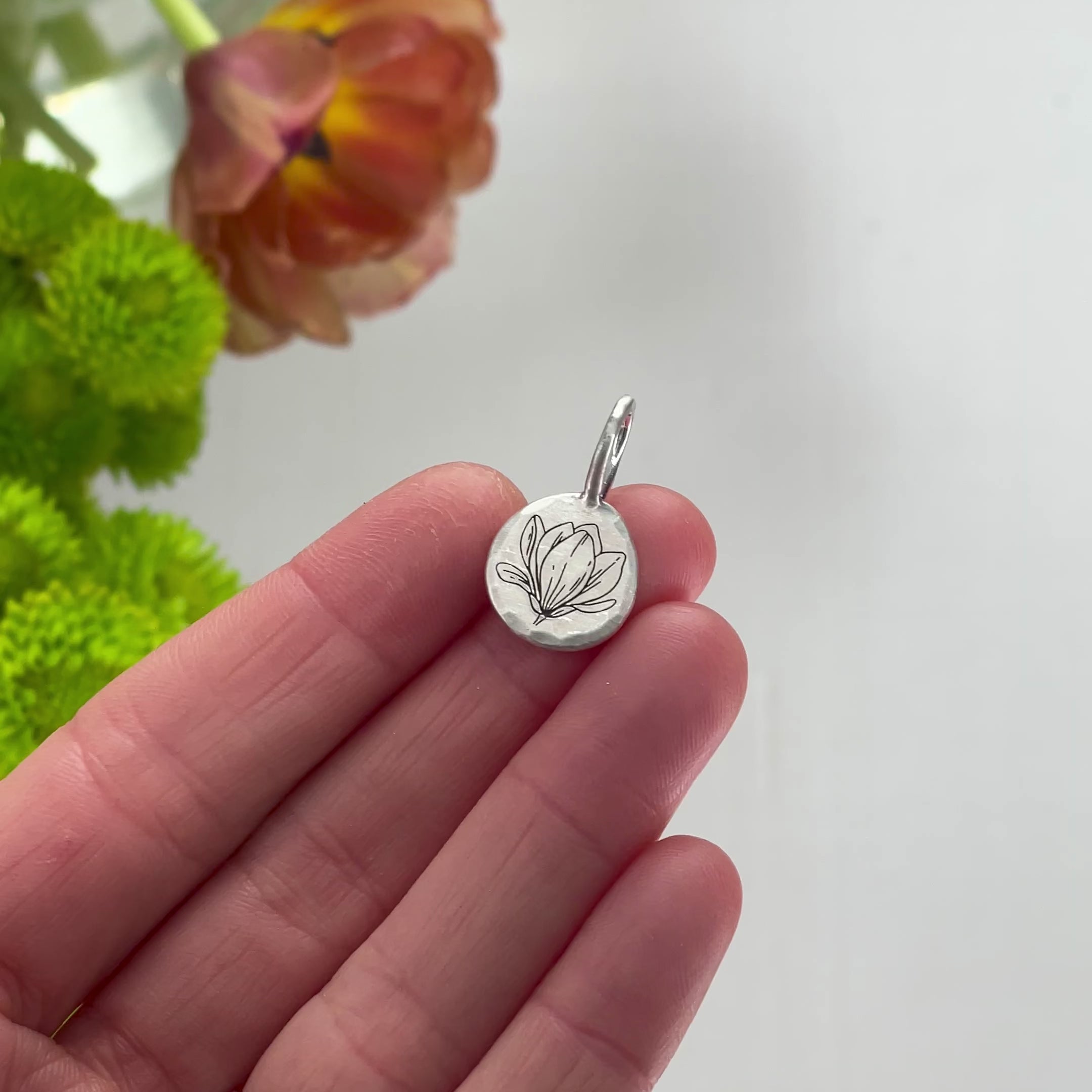 Load video: Engraved Magnolia Silver Pendant