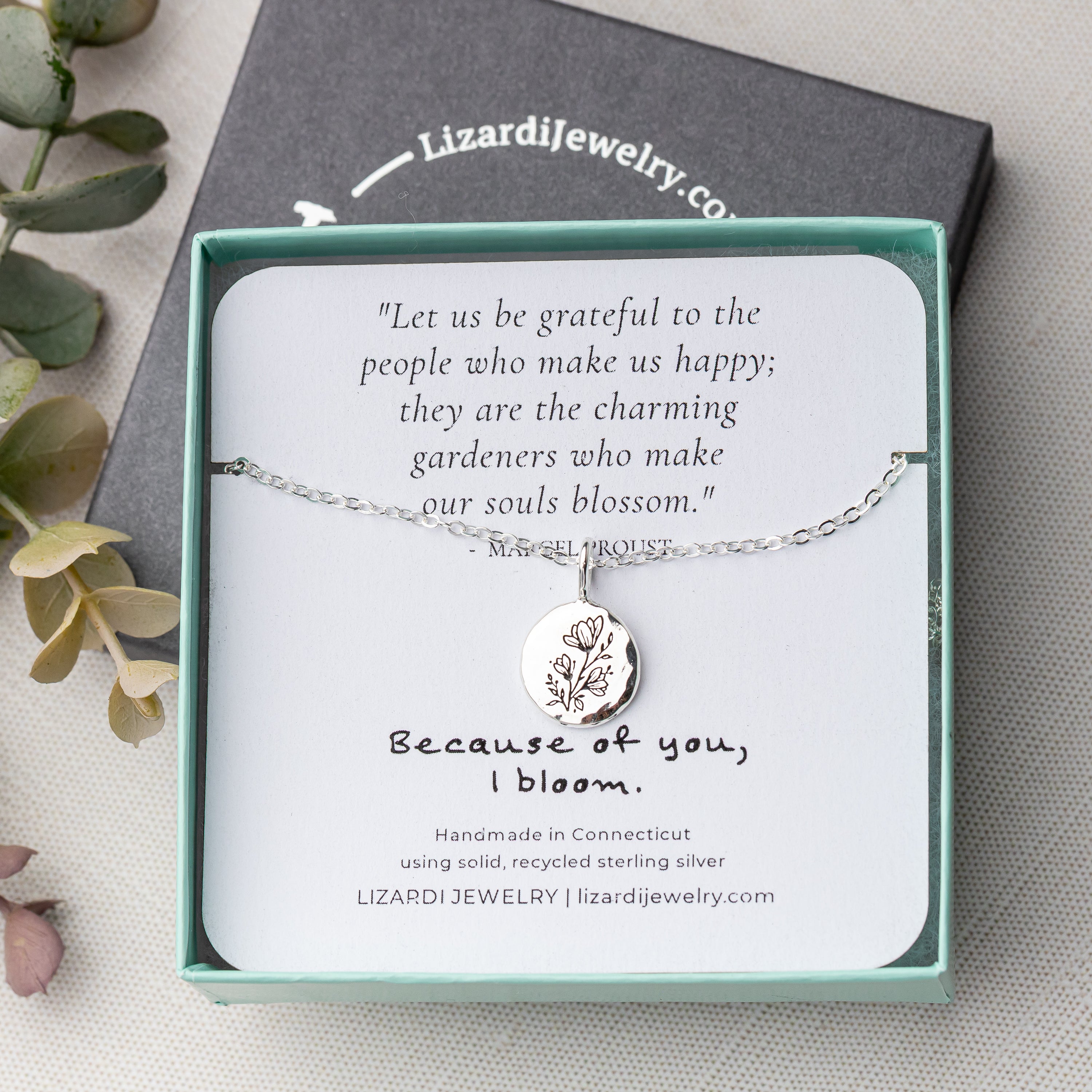 Gift box with silver pendant necklace and quote card for gifting